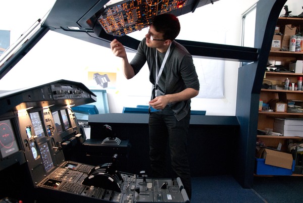 Person working on flight simulator assembly